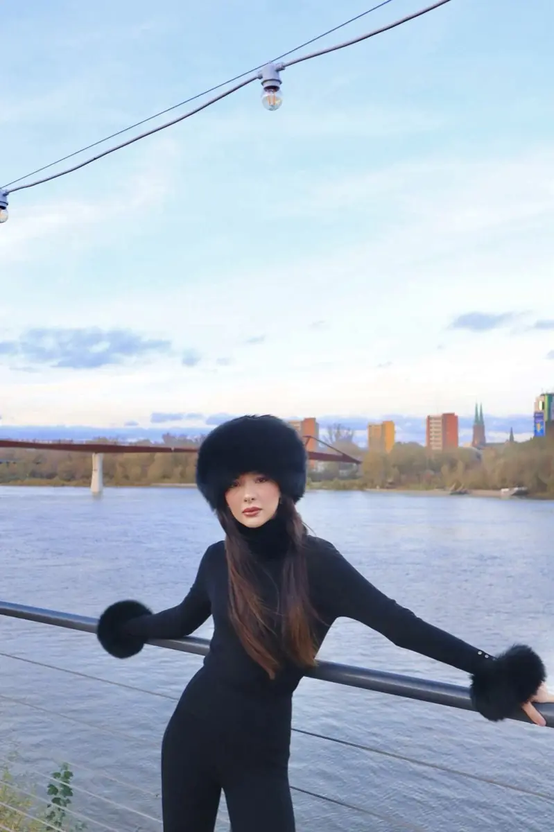 Full look in black with fur hat and cuffs