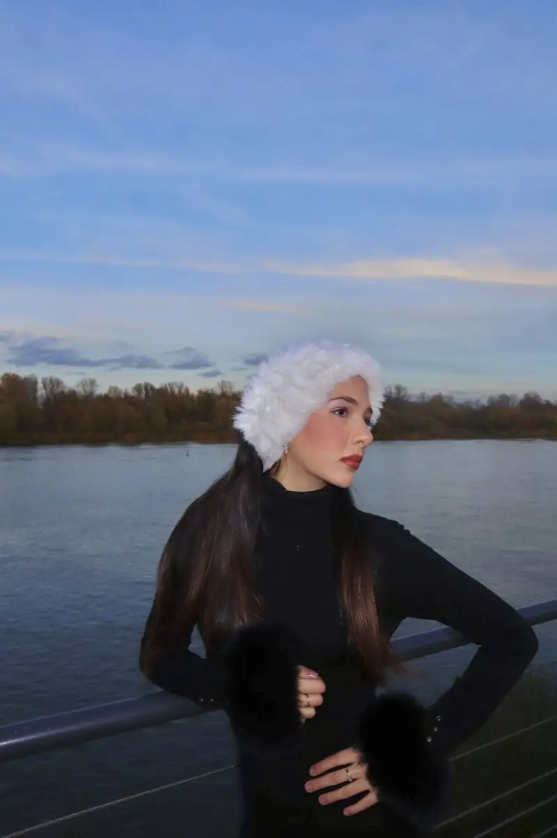 White fur hat with black fur cuffs